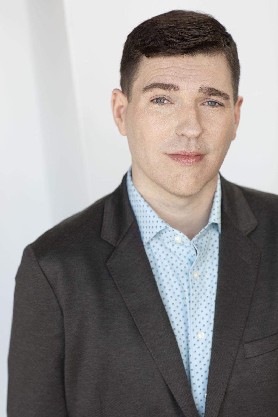 Mark Cashwell headshot in a grey blazer
