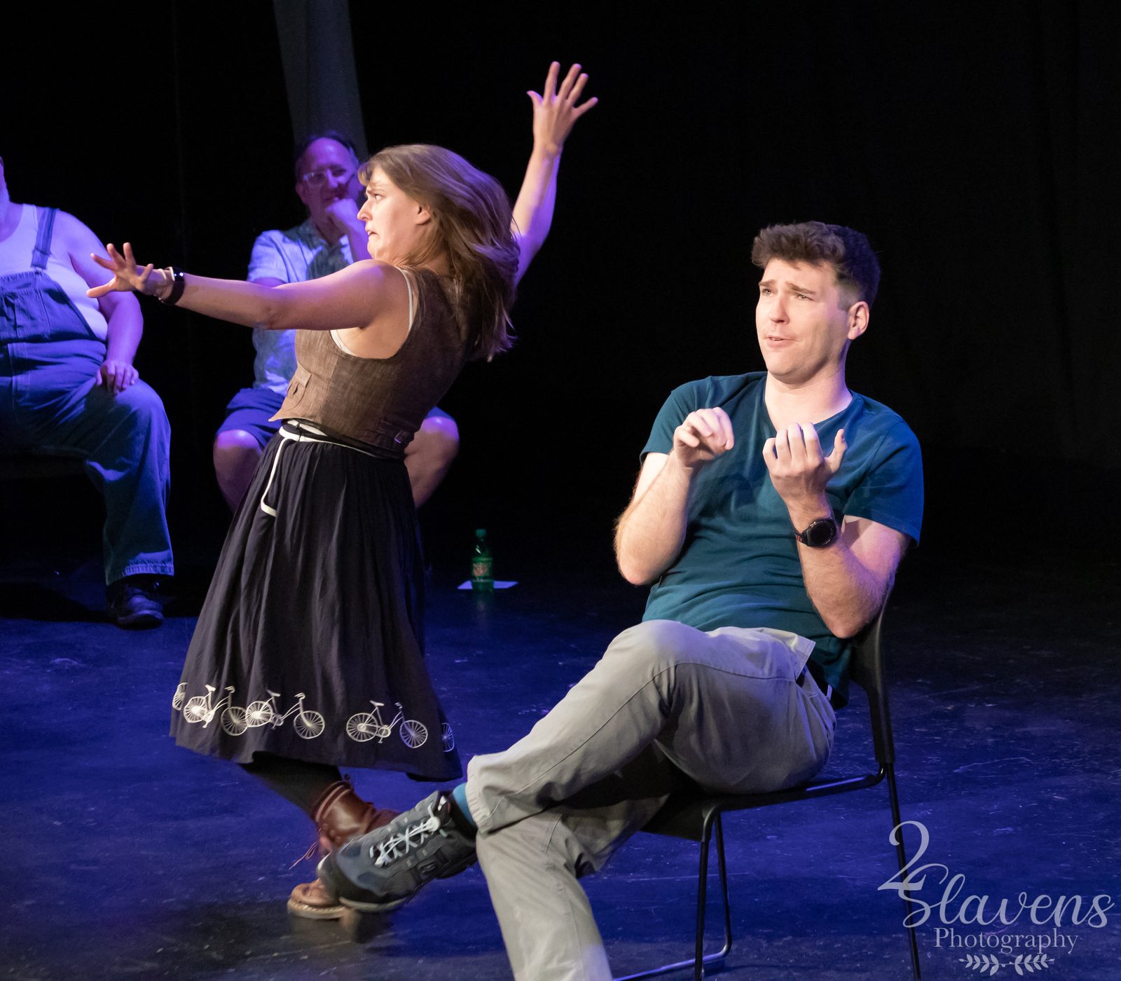 Mark performing improv on stage
